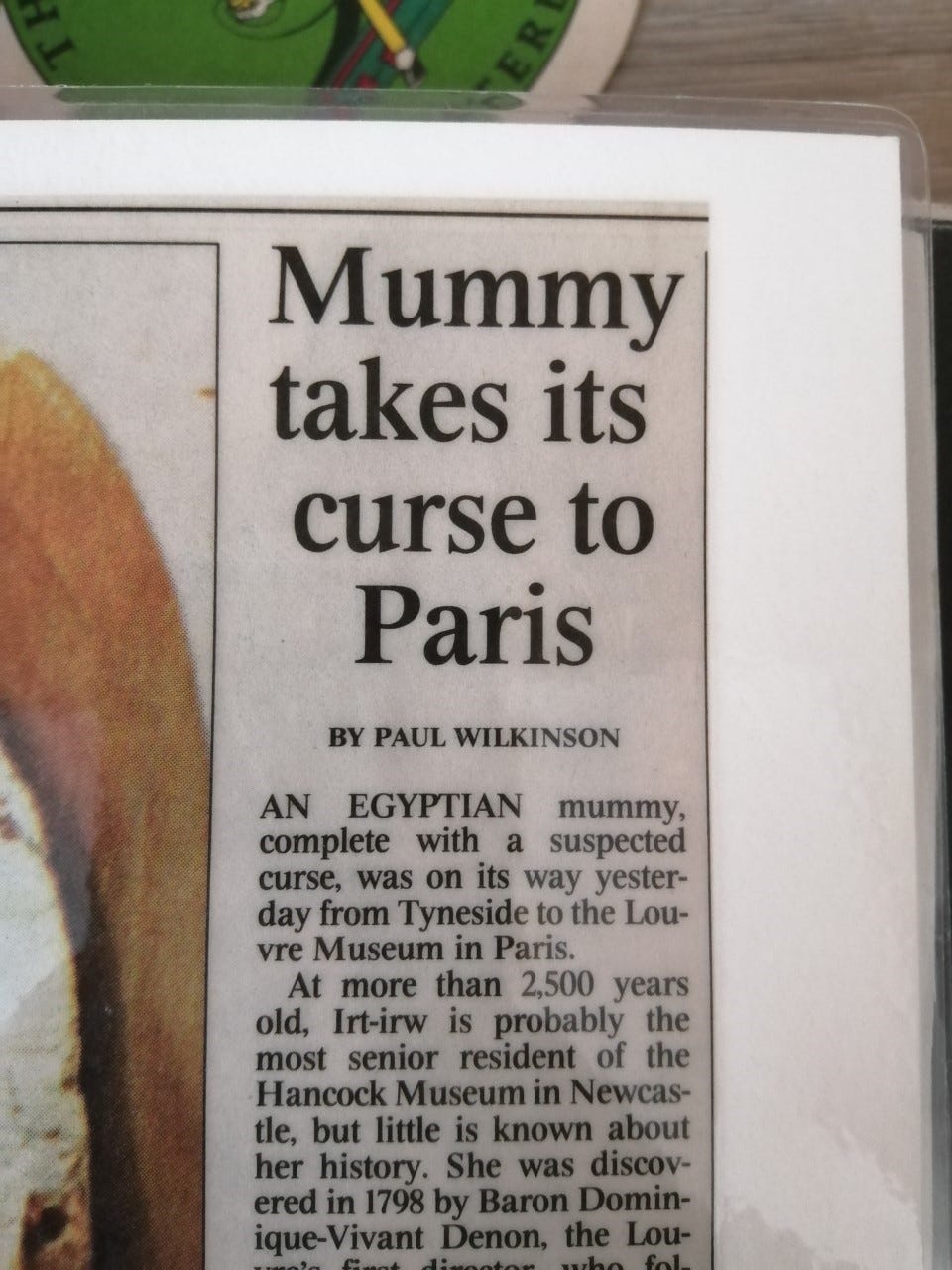 Newspaper article reading “Mummy takes its curse to Paris. An Egyptian mummy, complete with a suspected curse, was on its way yesterday from Tyneside to the Louvre Museum in Paris.”