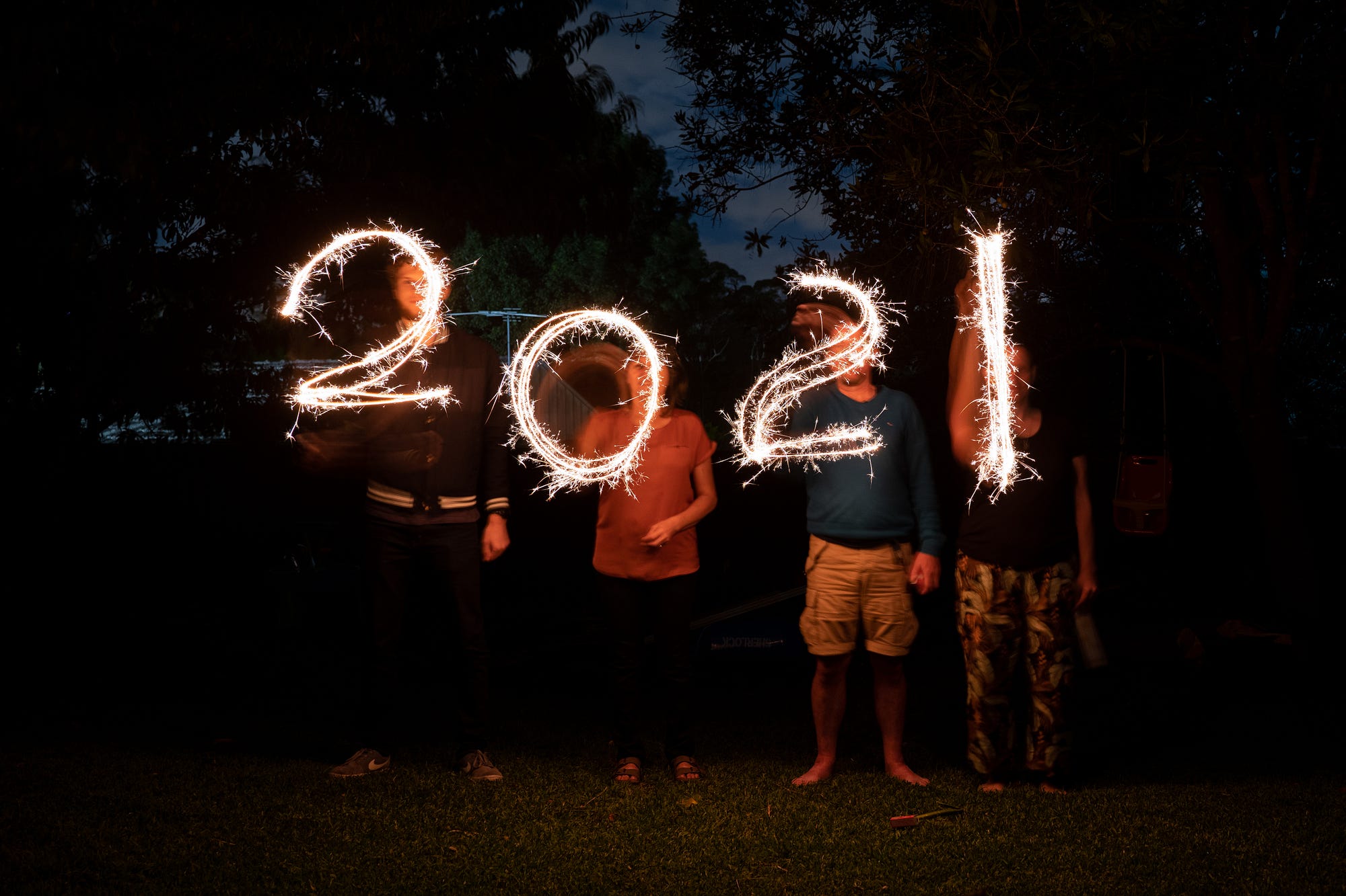 People spelling out 2021 with fireworks
