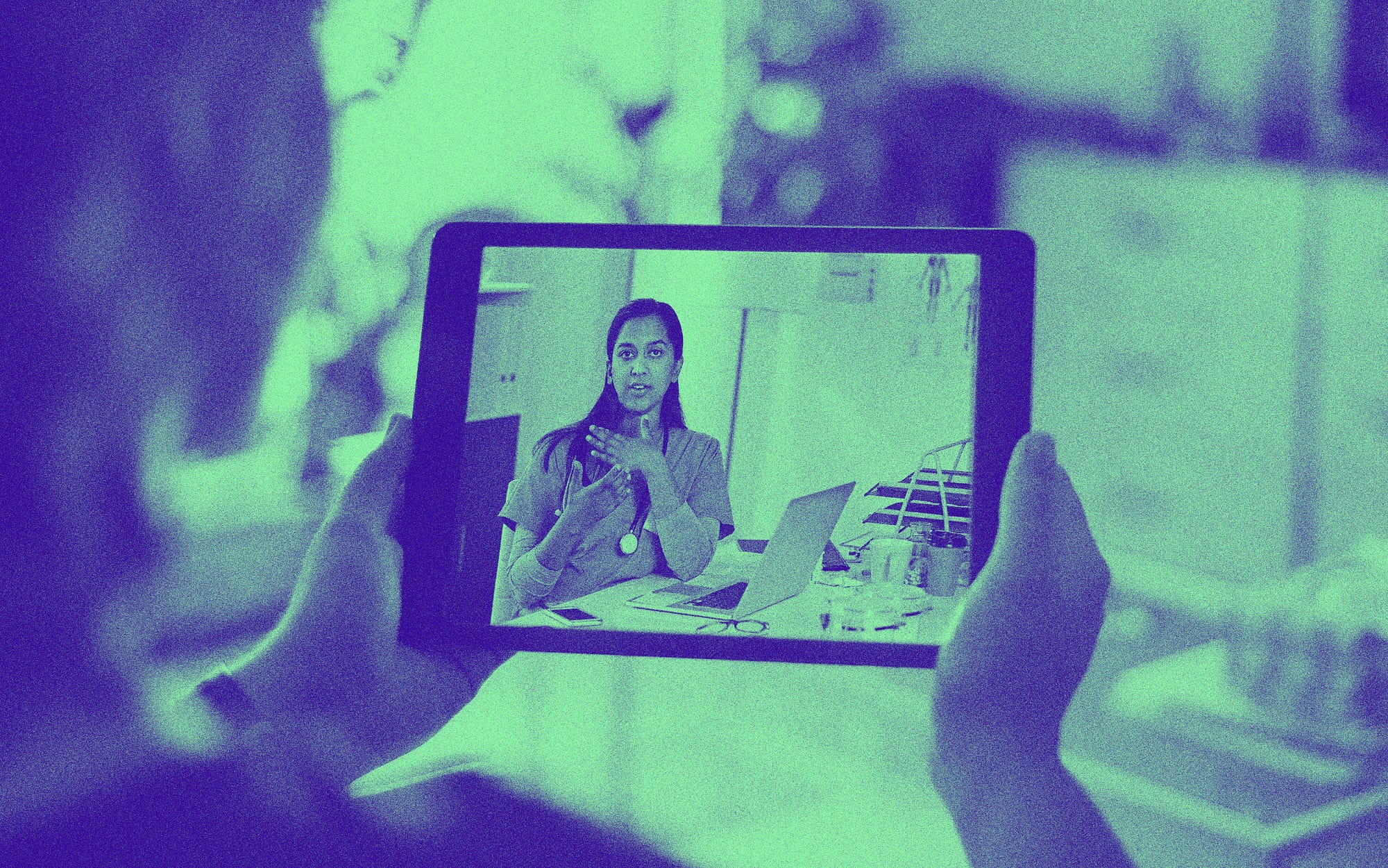 A woman holds up a digital tablet and talks to a doctor over teleconference.