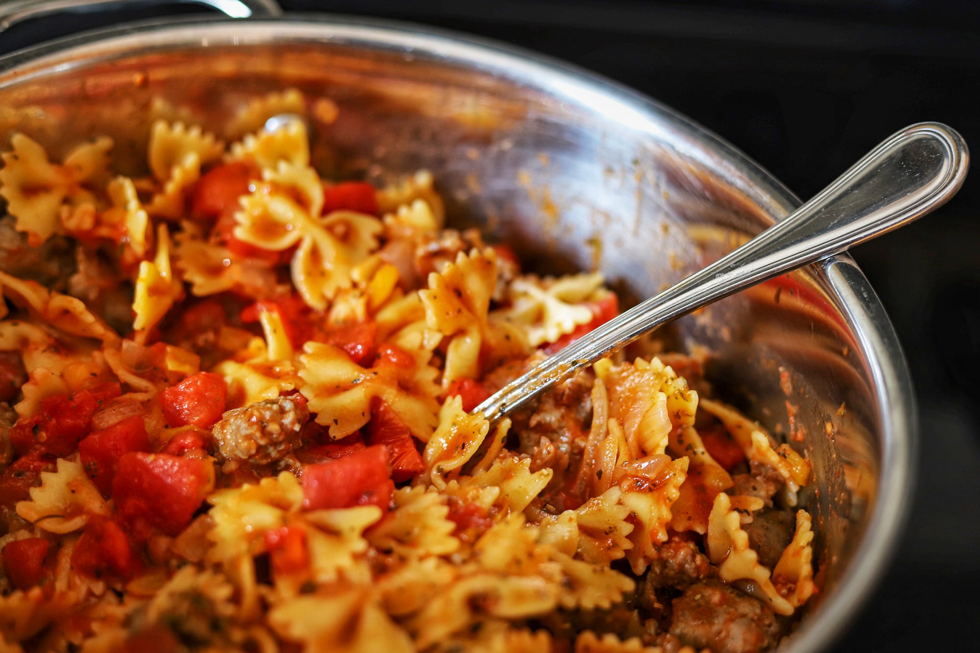 Sausage and bowties in a pan