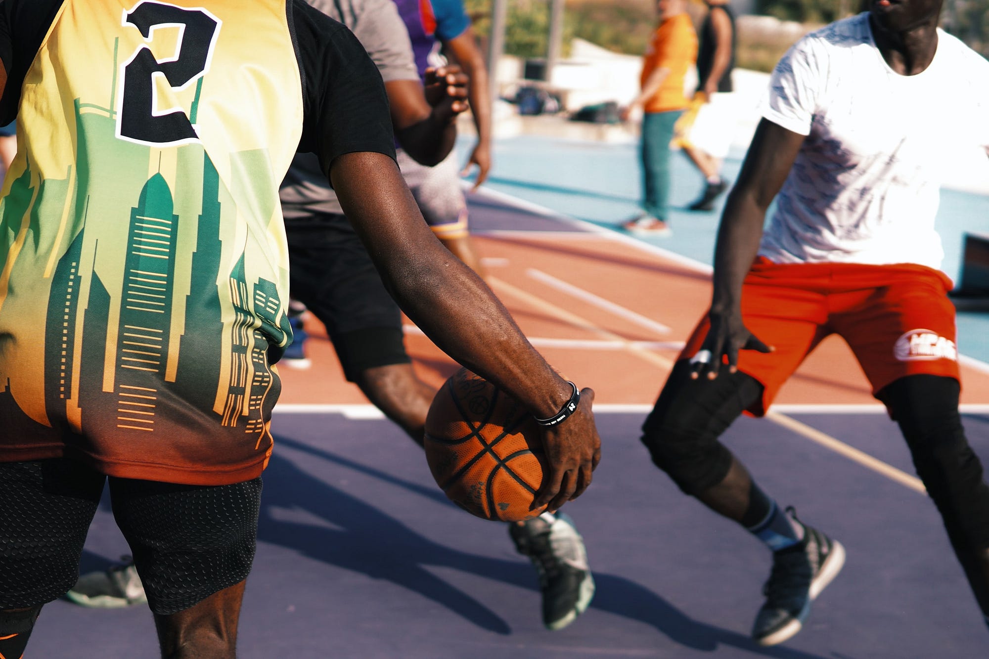 Young men playing basketball.