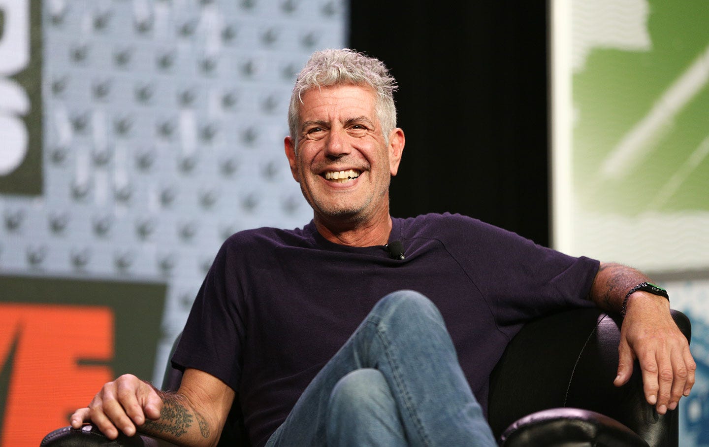 Anthony Bourdain sitting on stage at South by Southwest 2016