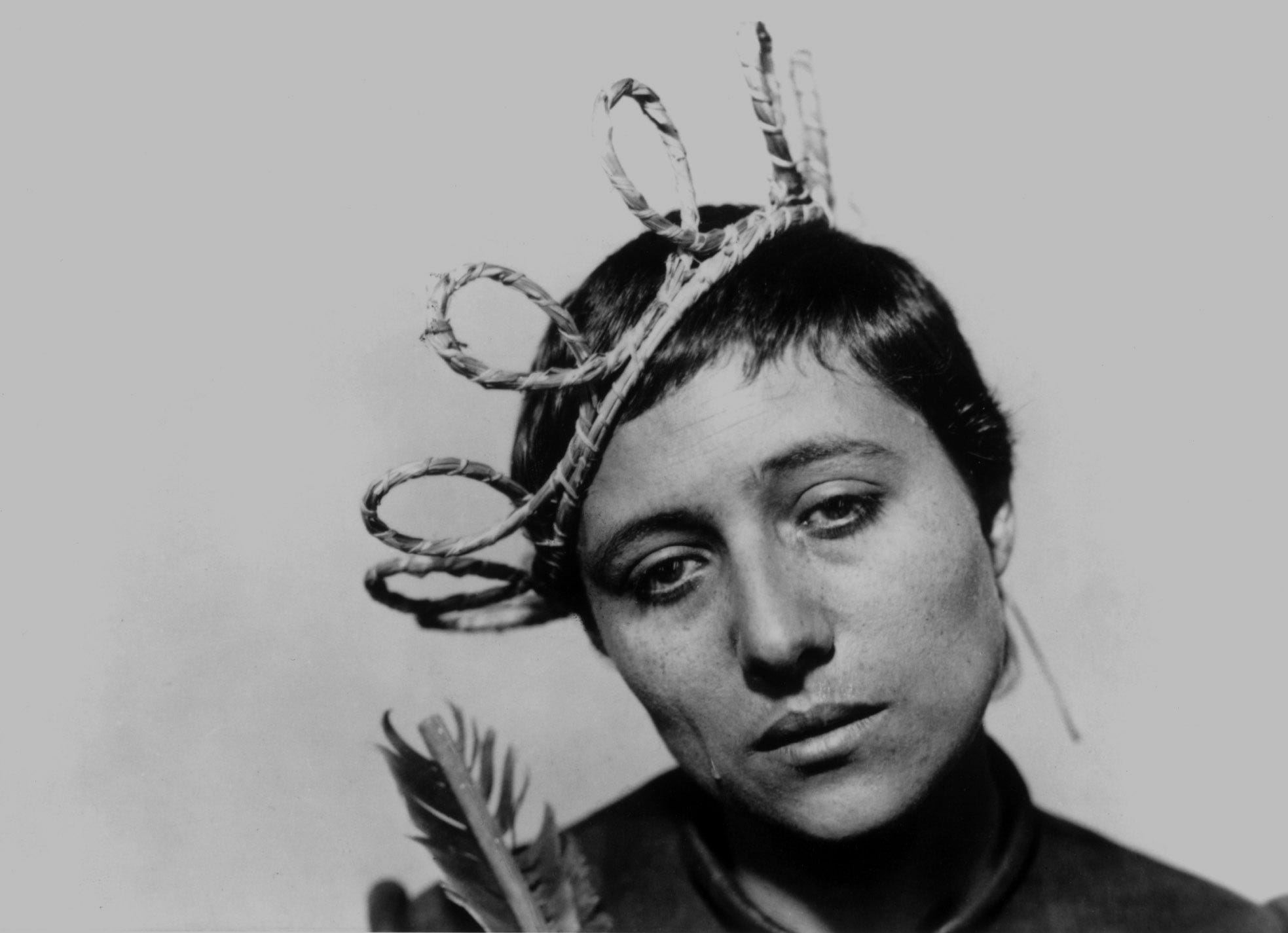 Still from The Passion of Joan of Arc. Joan looks despairing, dressed in a fake crown.