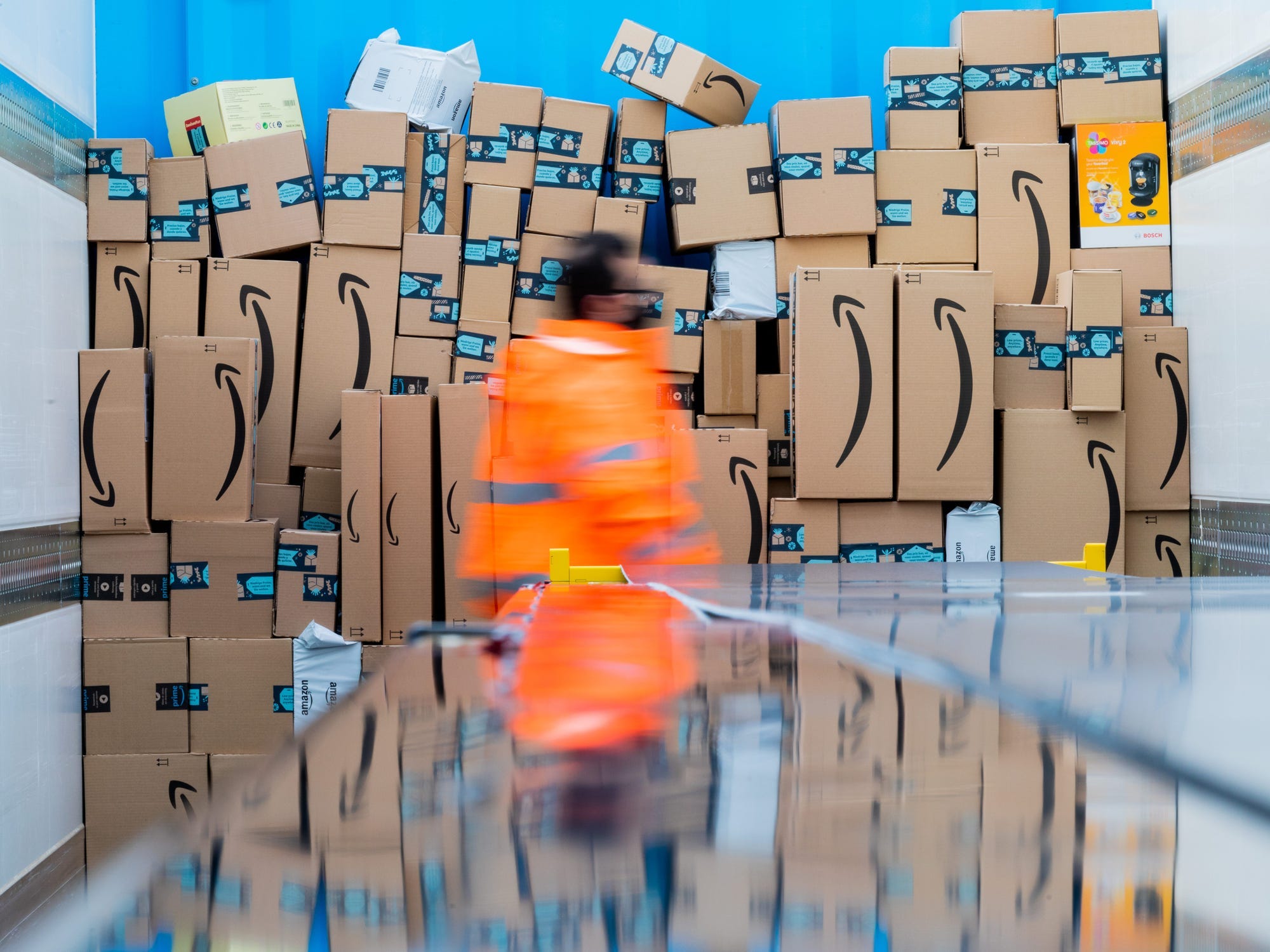 An Amazon worker among packages.