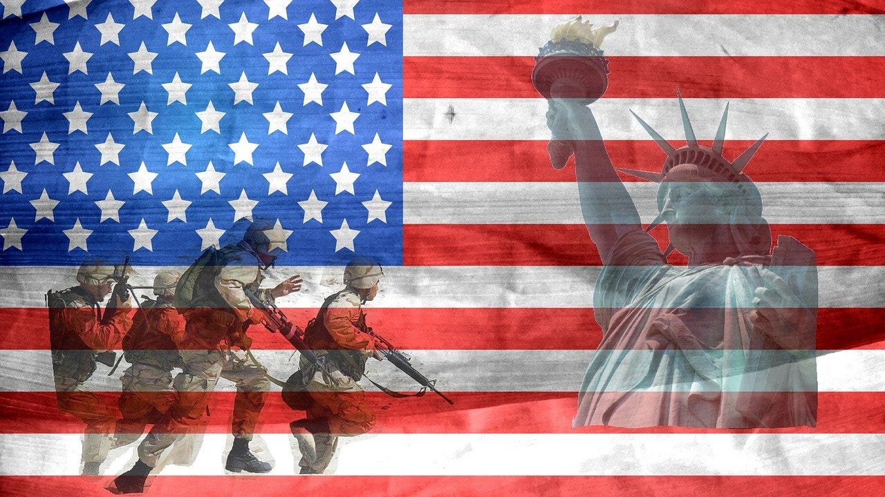 An American flag with a photo of the Statue of Liberty and four military members.