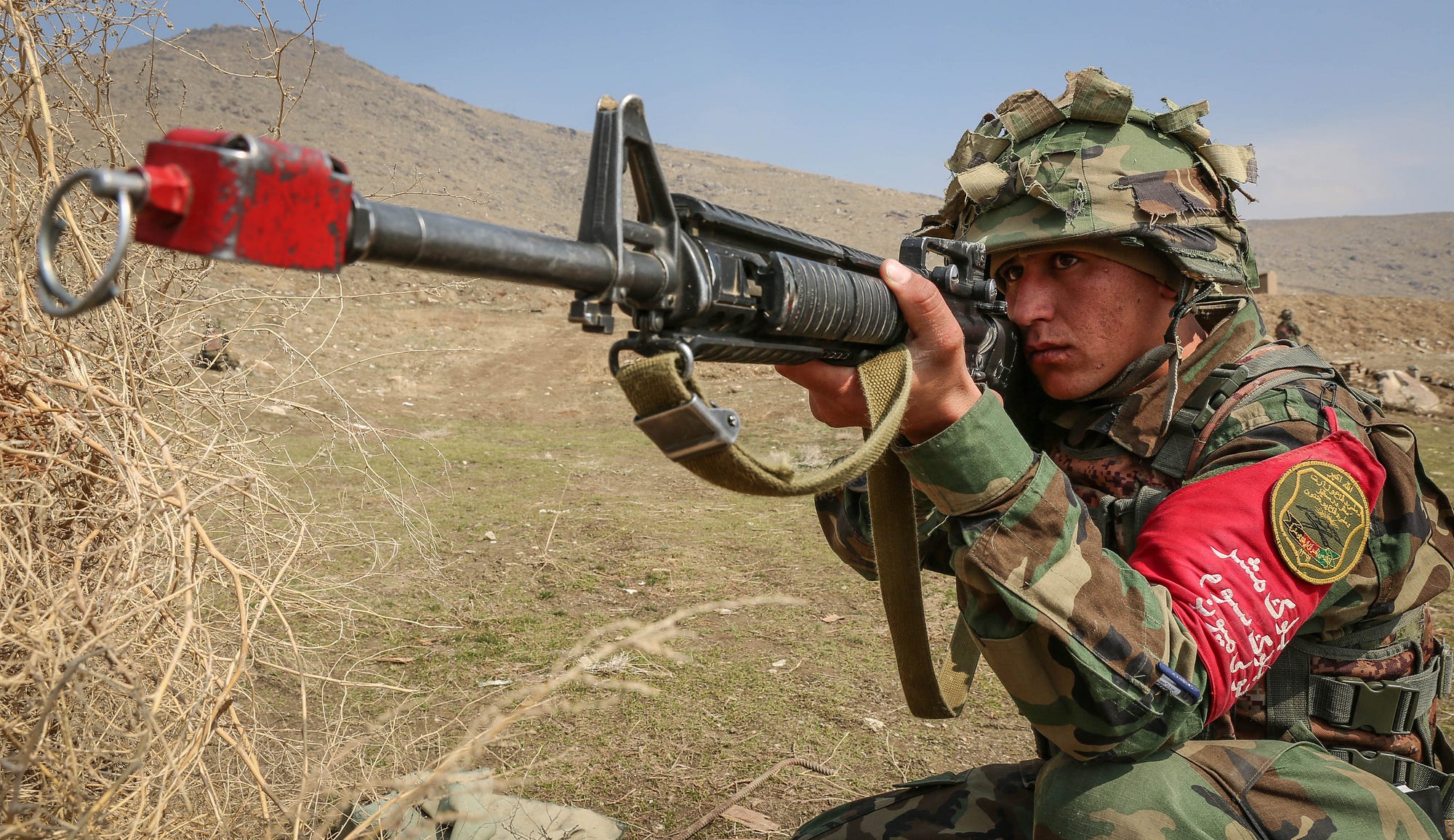 Members of the Afghan National Army take part in an exercise on the ANAOA plains in Kabul.