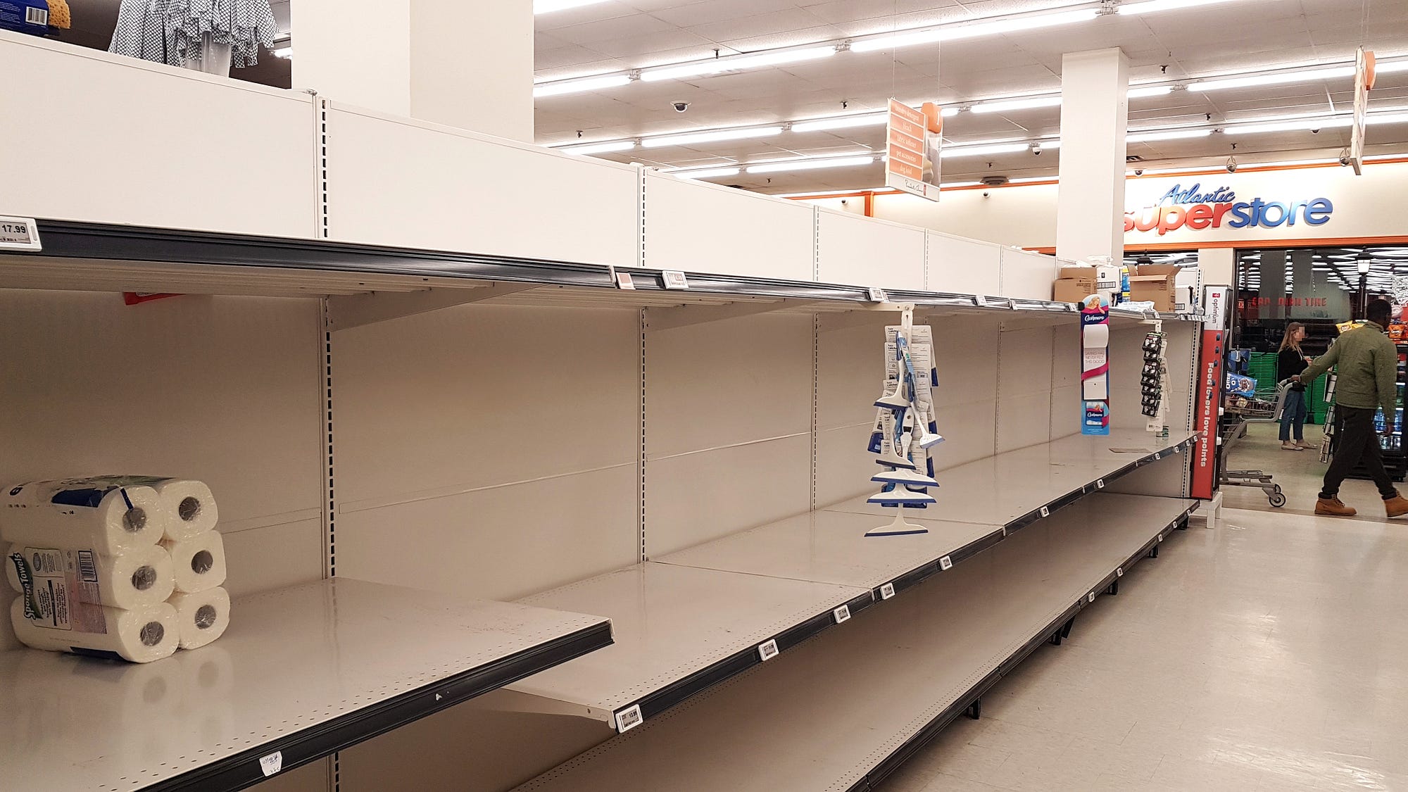 Empty shelves in the toilet paper aisle of an Atlantic Superstore supermarket of Halifax, Nova Scotia, Canada, on 12 March 20