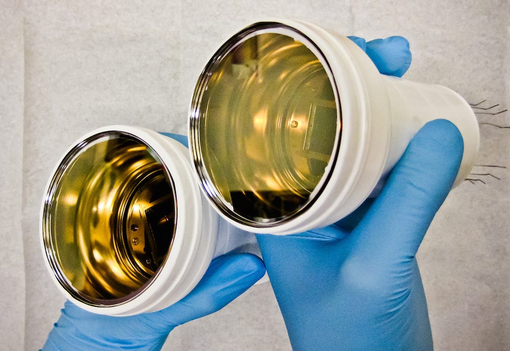 Can dark matter be seen? One detector to do so uses these white detectors with a golden inside, looking like track lighting.