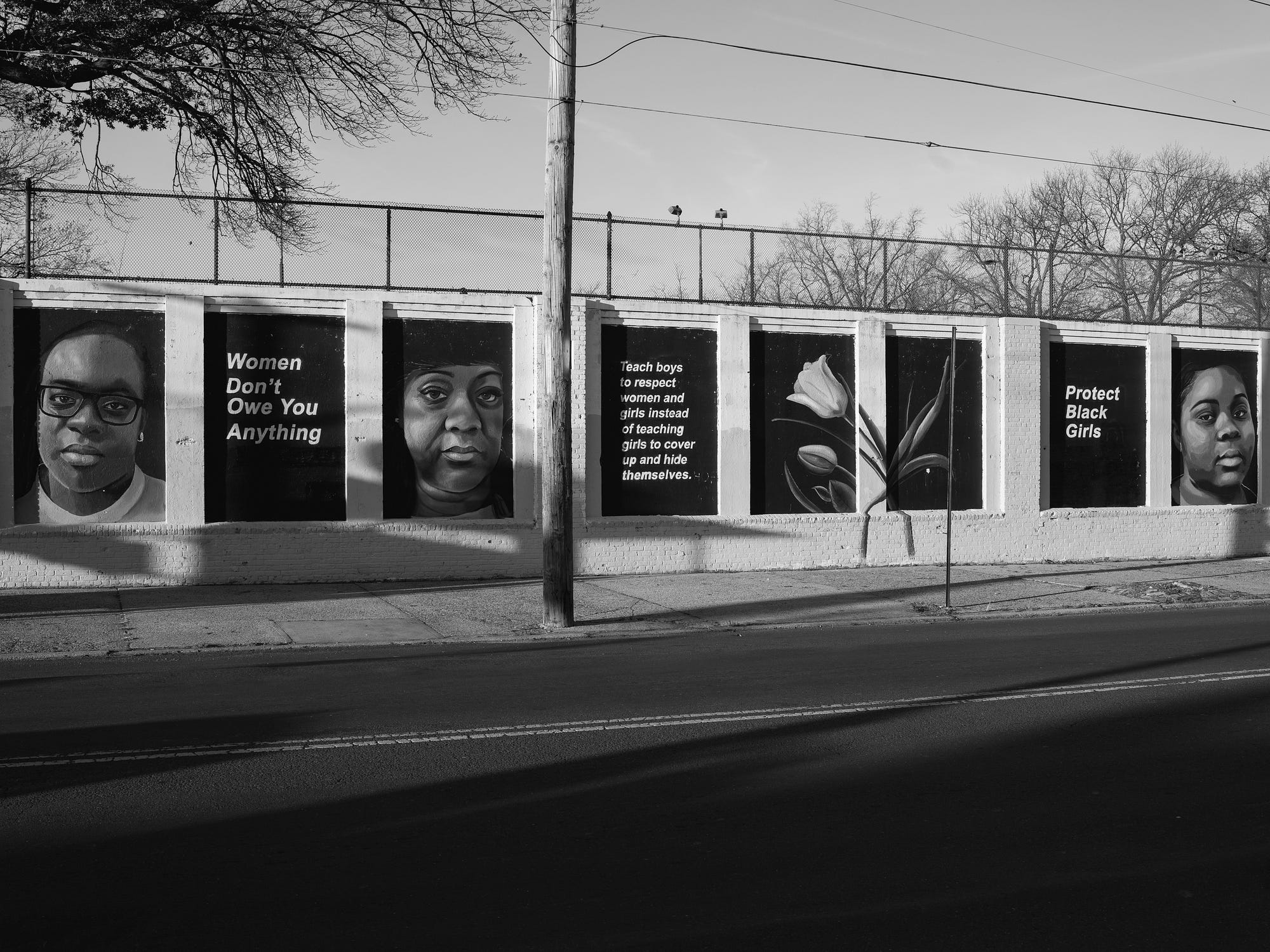 A mural in Queens created by artist Tatyana Fazlalizadeh represents community conversations and faces of Queens-based women.