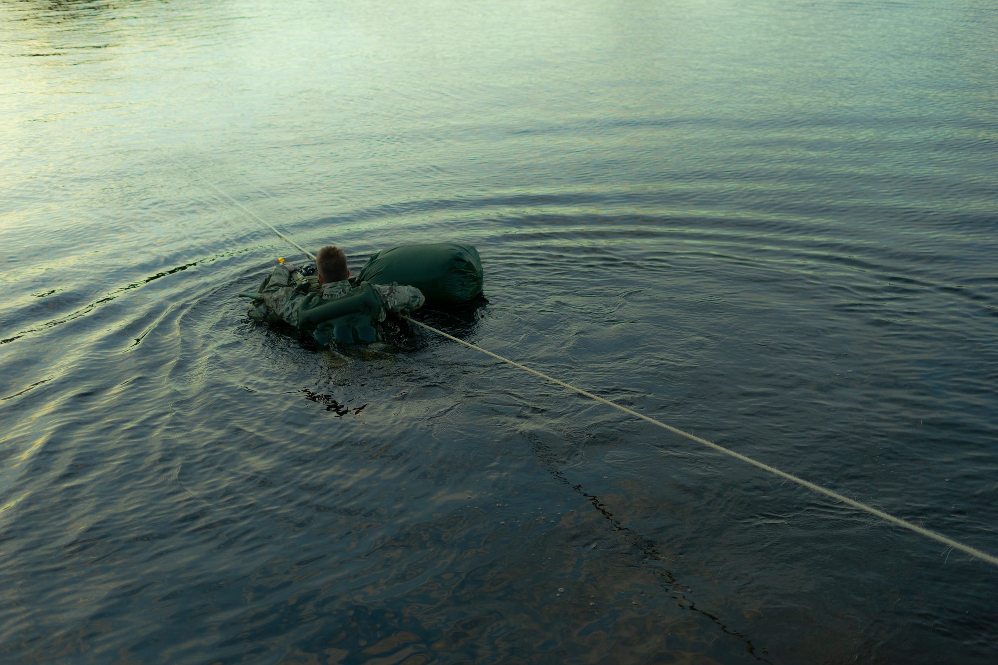 British soldiers from Queen’s Royal Hussars conduct a river crossing whilst on Cambrian Patrol 21.