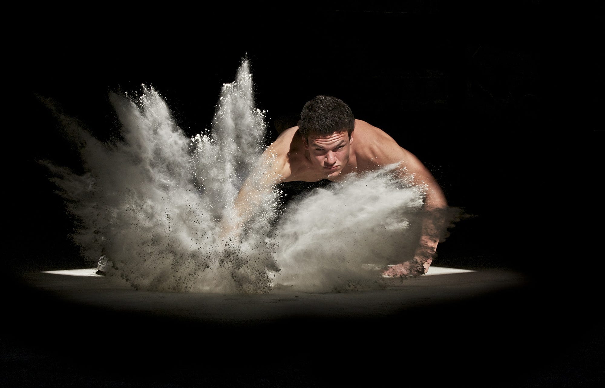 A man punching the ground.
