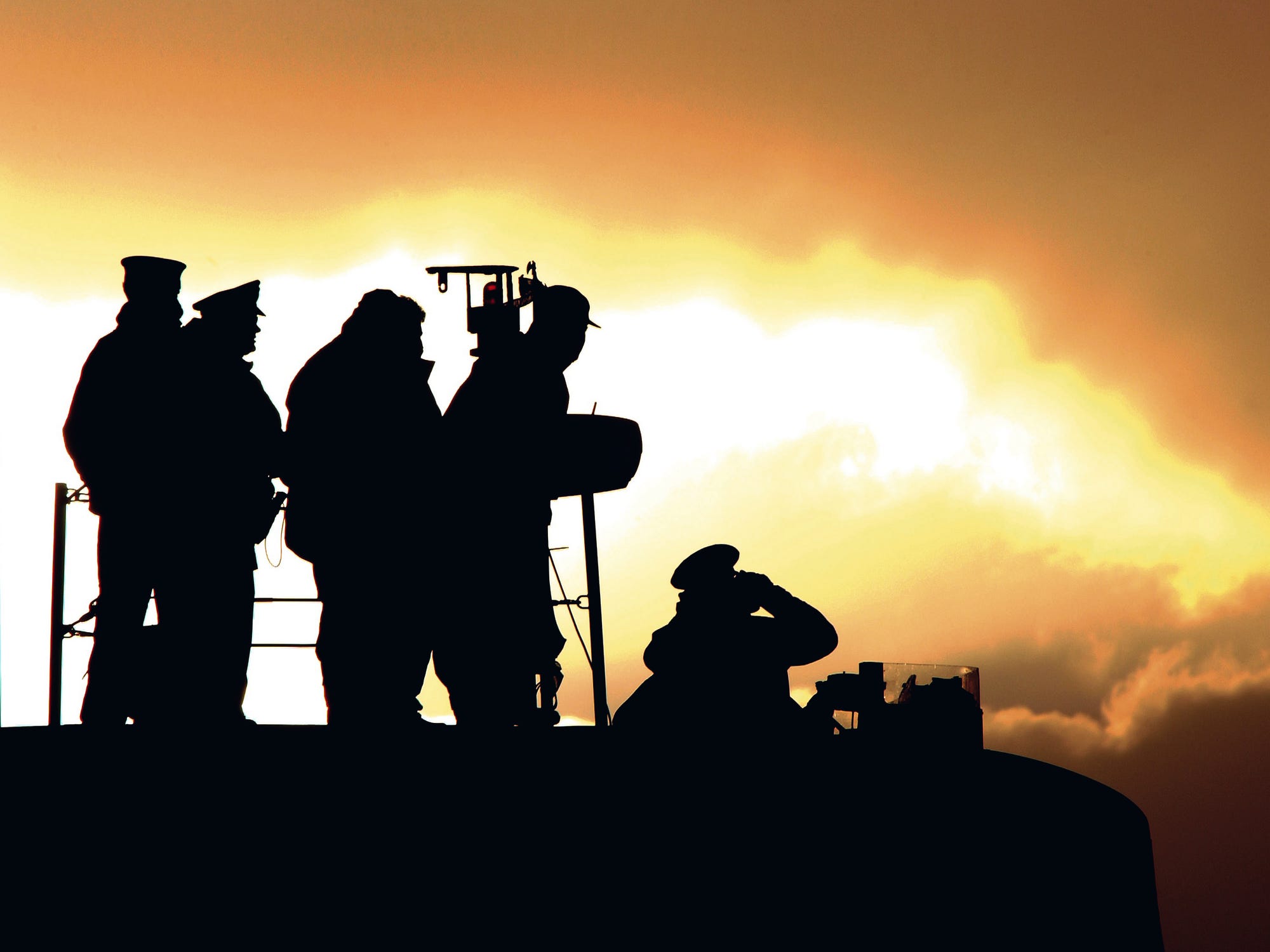 The crew of HMS Victorious on deck as she leaves her home port of HM Naval Base Clyde.