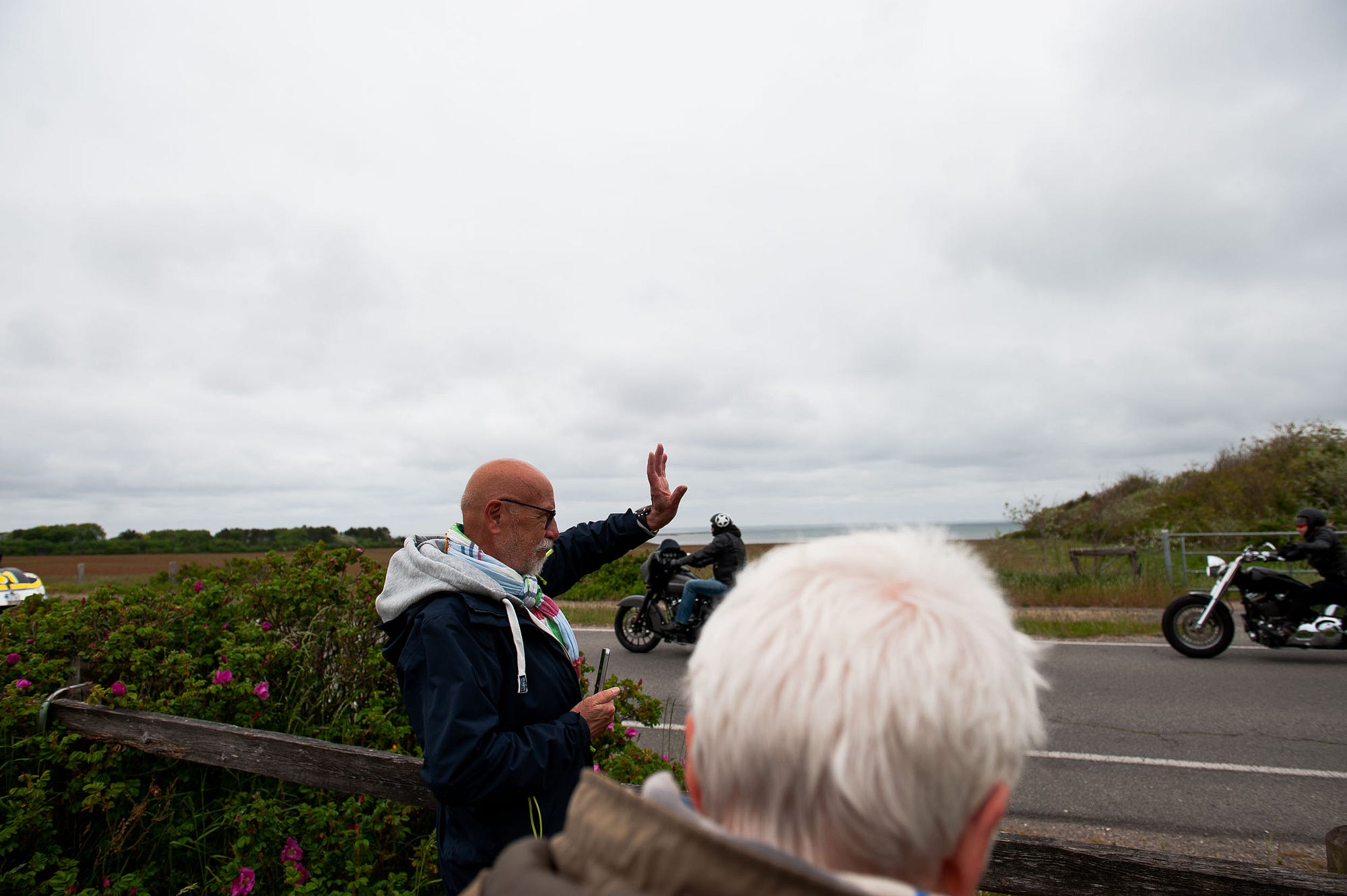 Dad waves at the participants of the Harley Davidson parade that was crossing the island. Sylt, Germany, May 25, 2019.