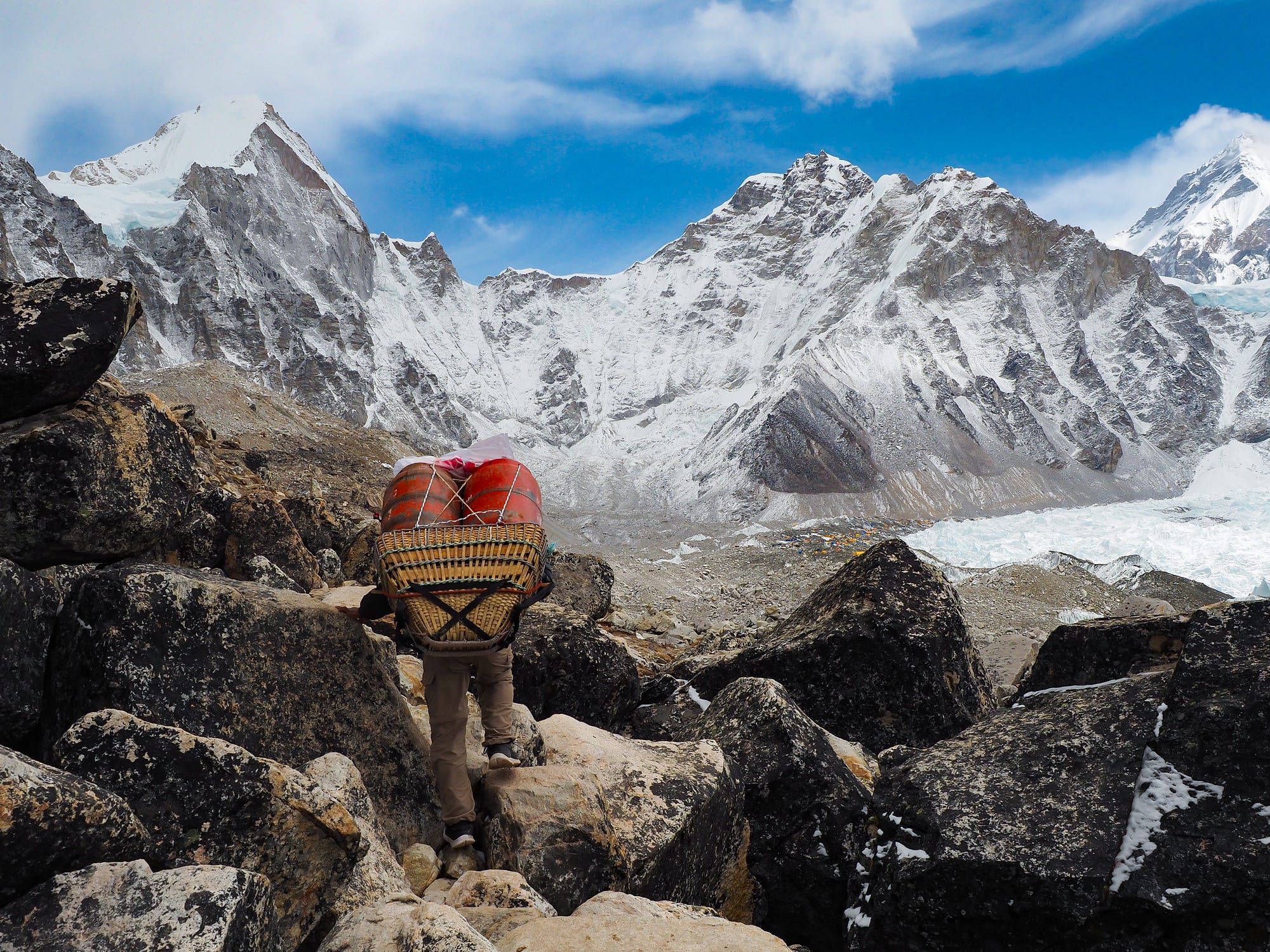 A sherpa hauls supplies on the south side of the Everest Base Camp trek, at an altitude of 17,900 feet (5,500 m).
