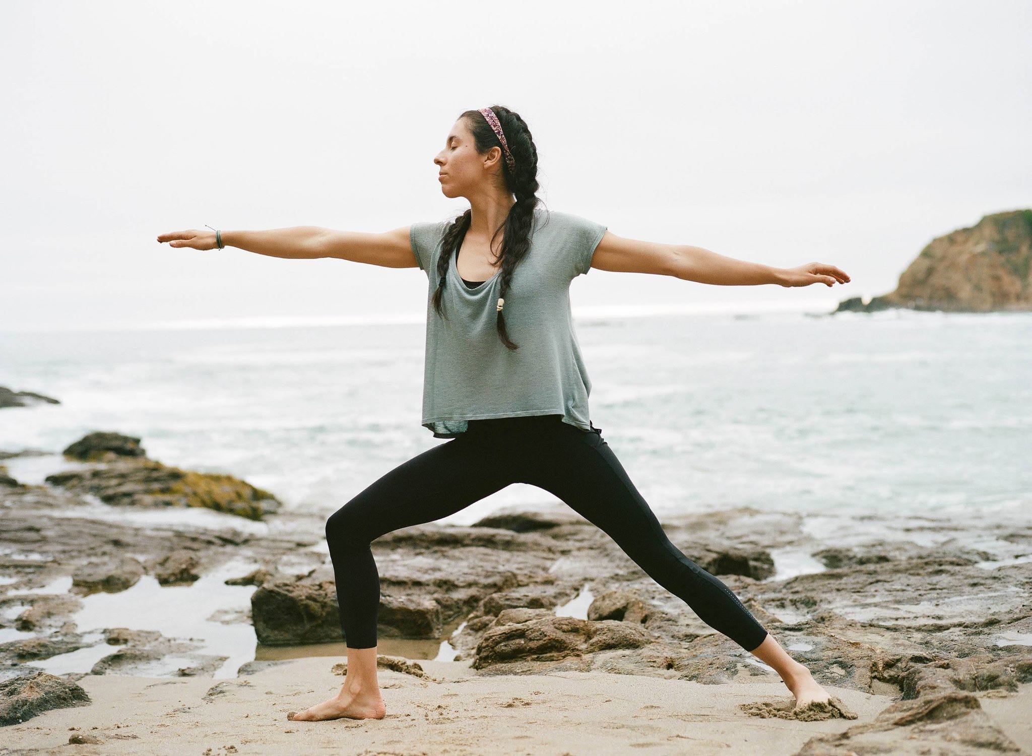 Kadisha performing Virabhadrasana II, or Warrior 2