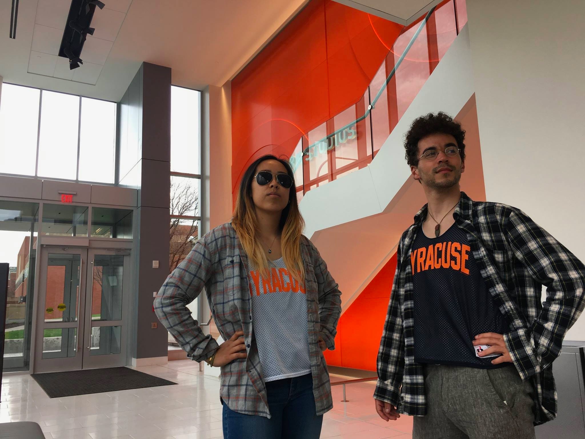 students looking off into the distance in Newhouse building