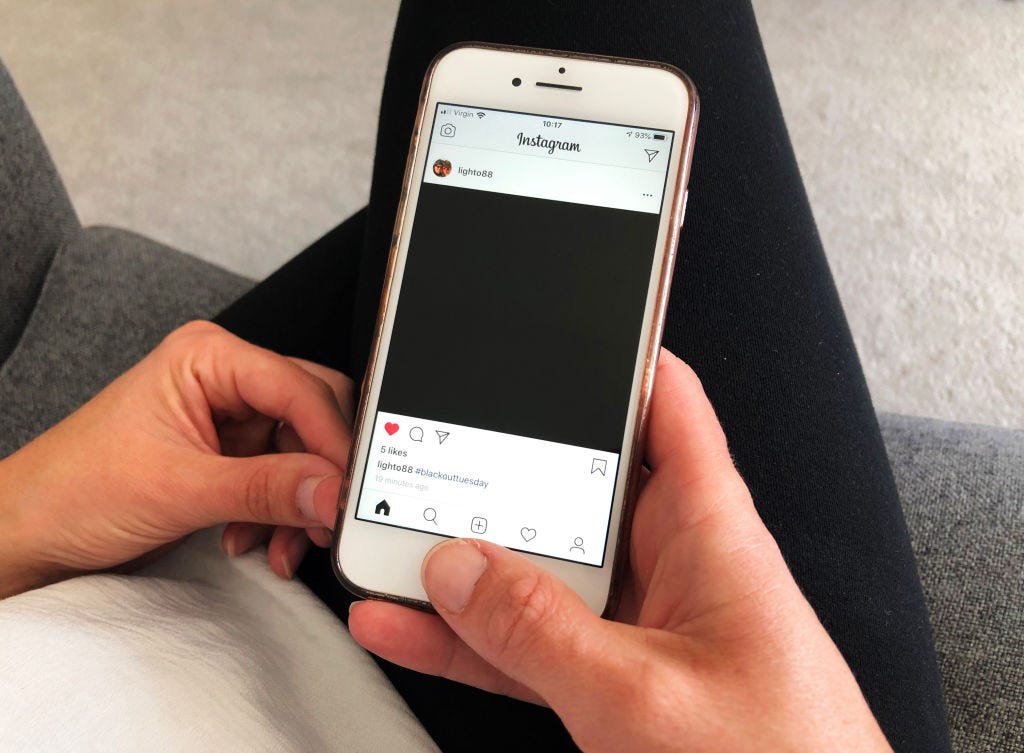 A photo of an Instagram post of a black square as part of #BlackOutTuesday.
