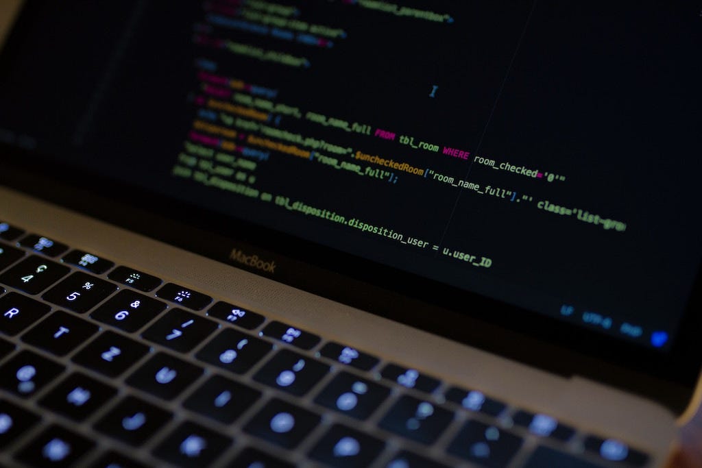 A macbook pro coding in CSS