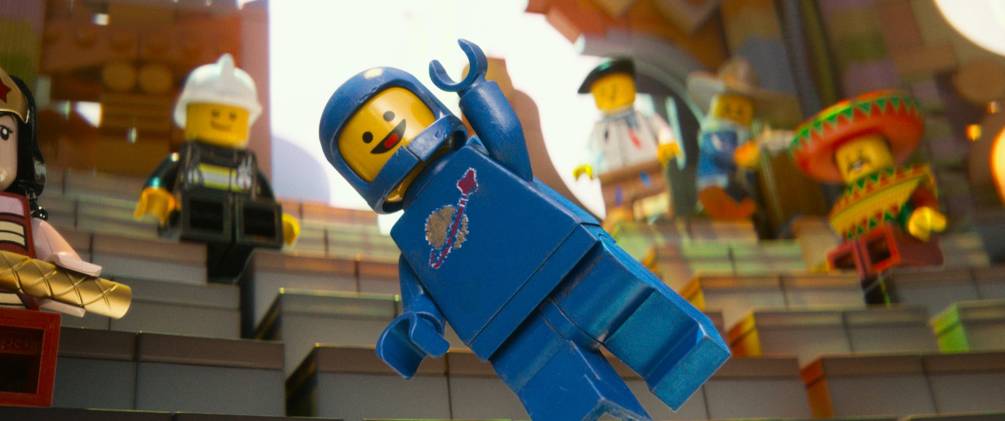 A Lego astronaut jumping up and saying "Yes!"