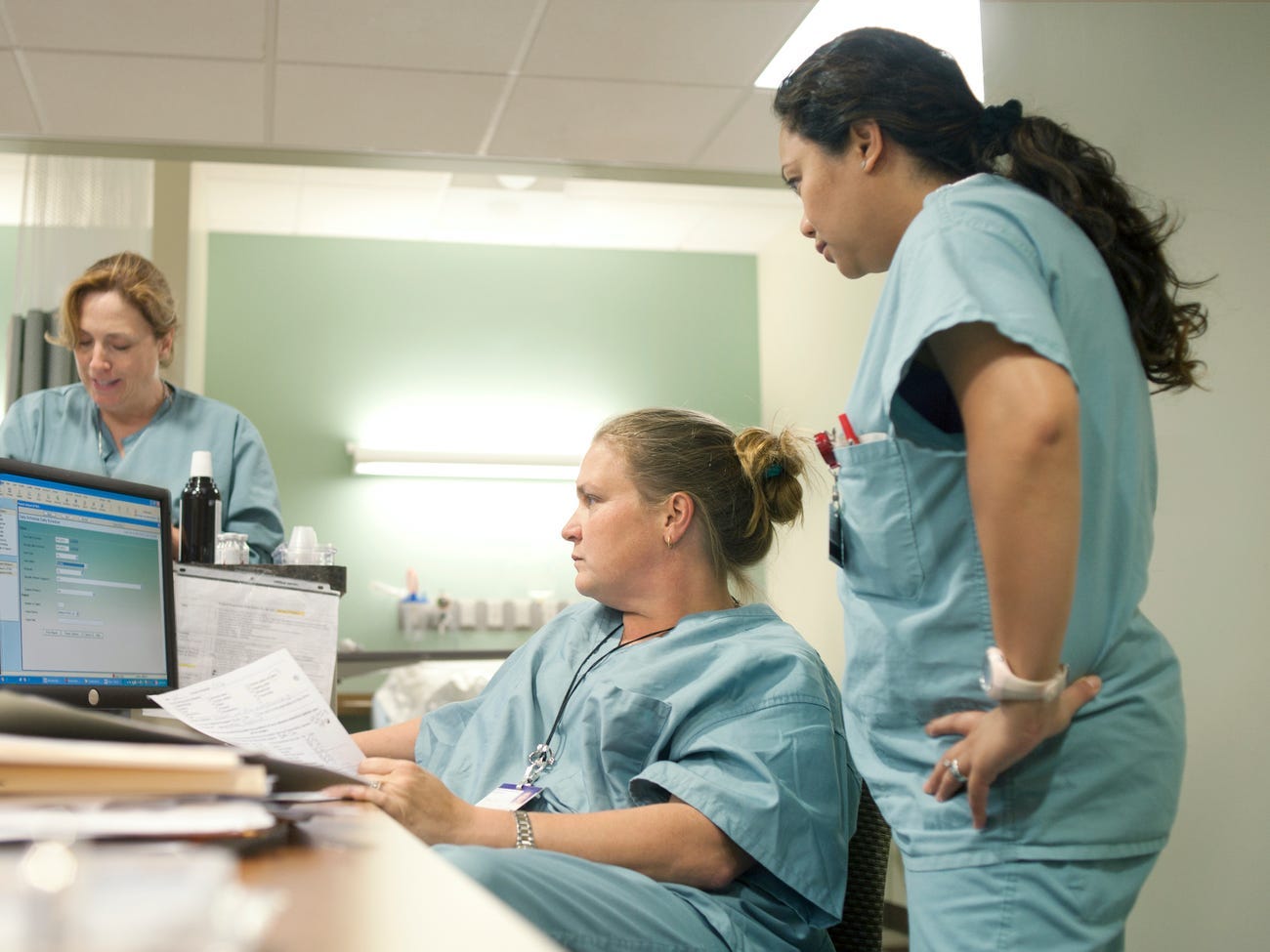 Three nurses in a hospital.
