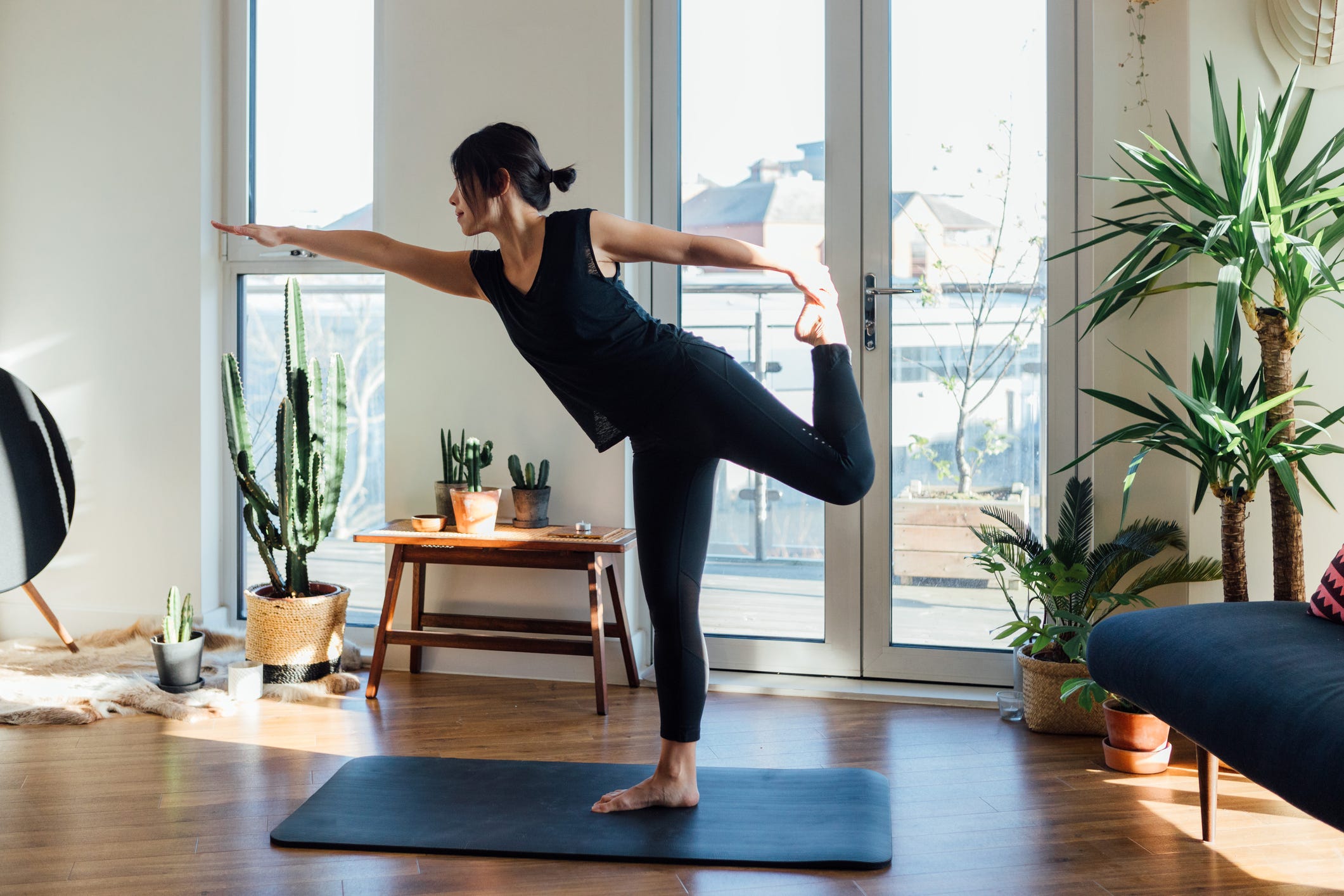 Woman working out in her living room.