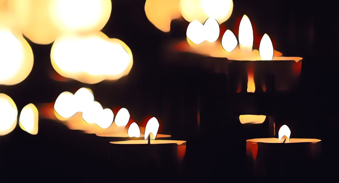 Stylized image of multiple candles with light flares