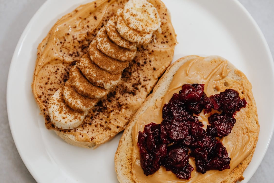 Two slices of toast with peanut butter