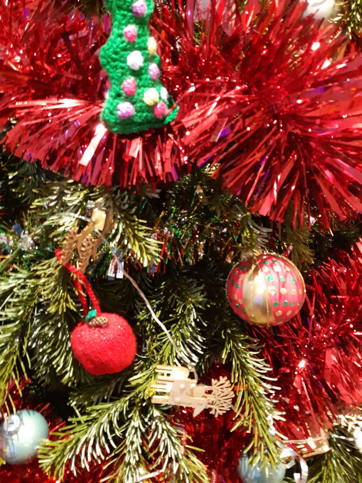 A close up of tinsel on a Christmas tree