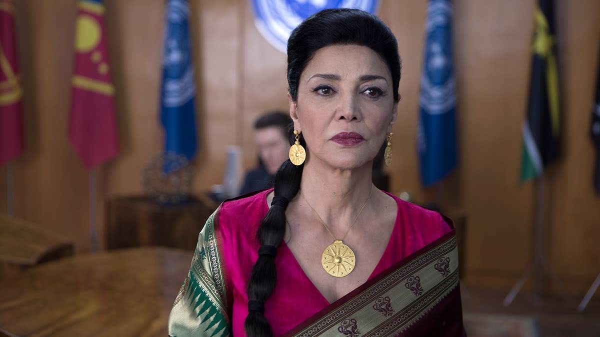 Older women in sari and gold statement jewelry.