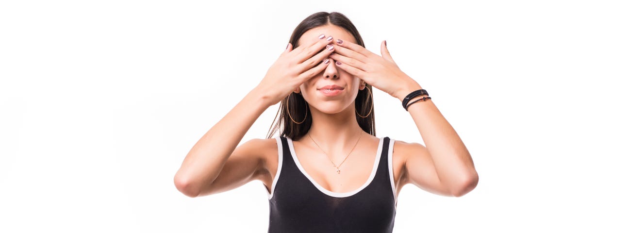 Woman covering her eyes