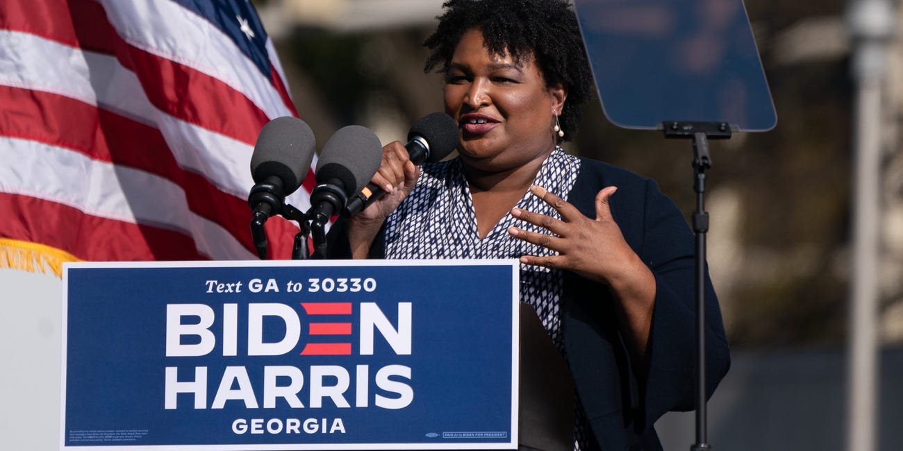 Former US Representative and voting rights activist Stacey Abrams speaks at Biden event.