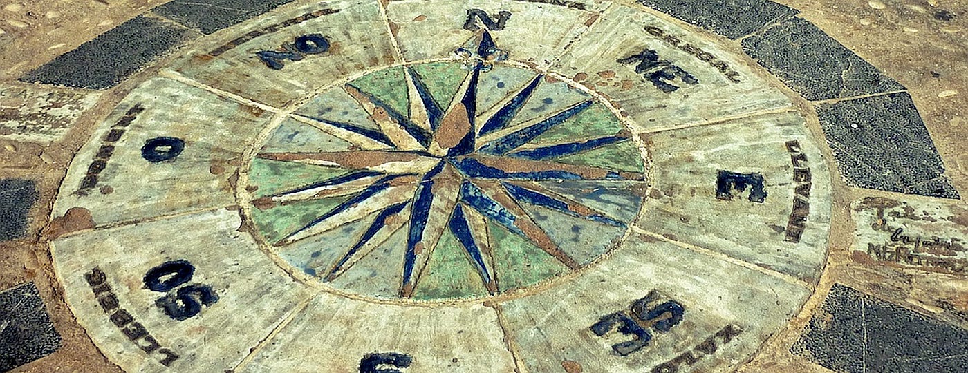 An ancient compass made of painted floor tiles