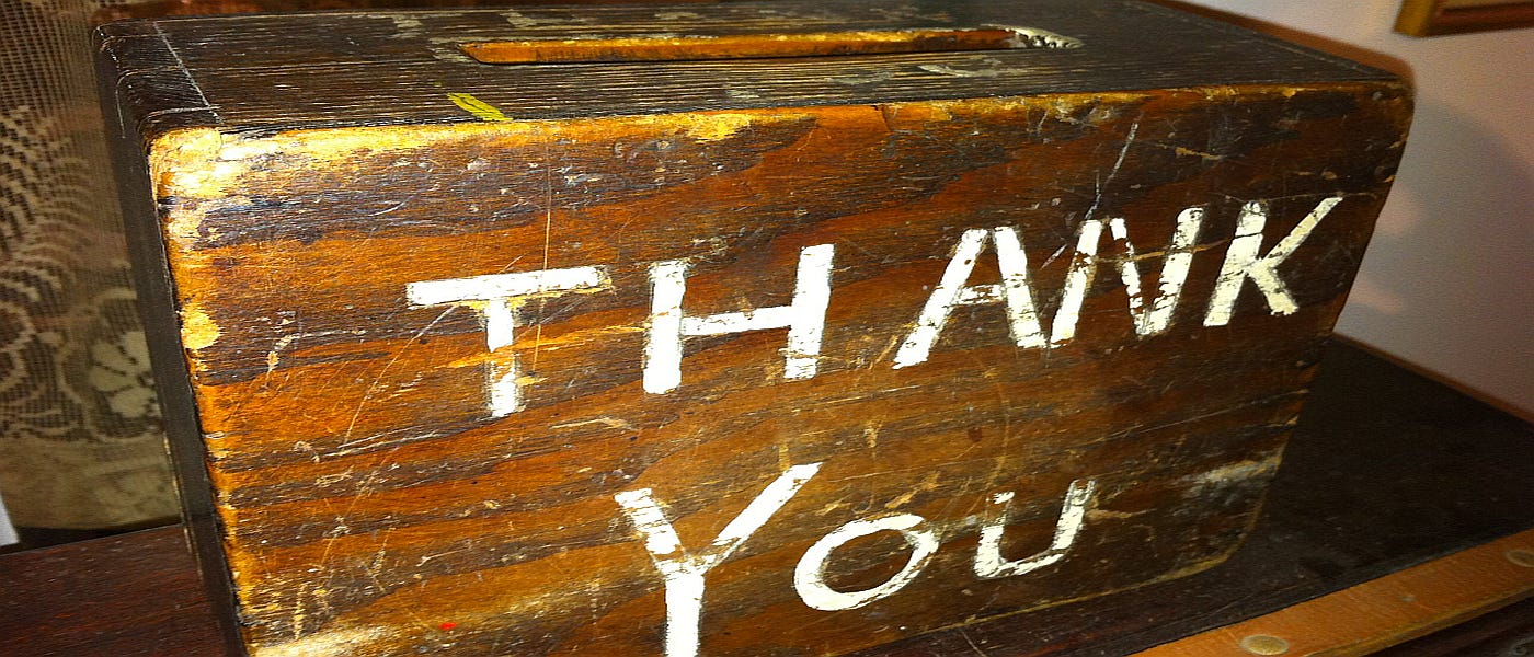 Wooden collection box with the inscription ‘Thank You’