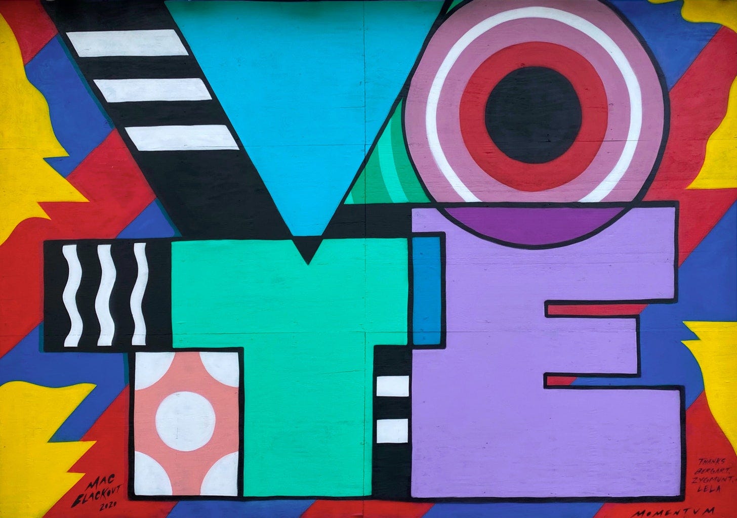 Bright colored geometric mural of the word VOTE with VO at the top and TE at the bottom