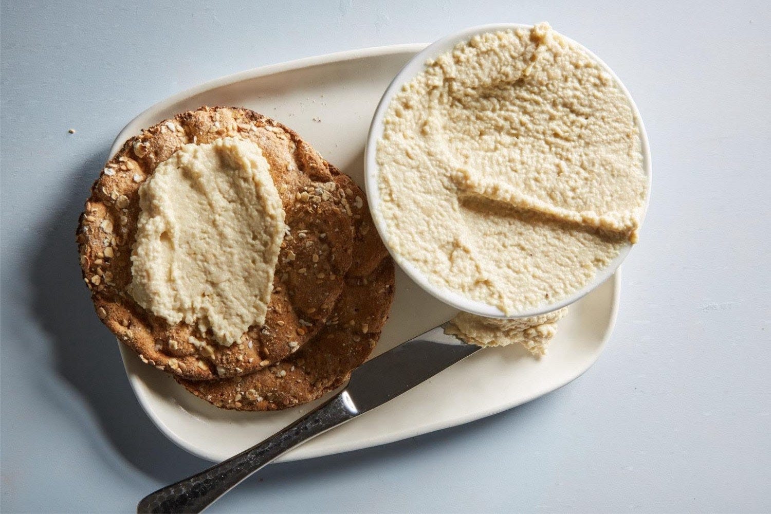 A photo of cashew cheese on crackers.
