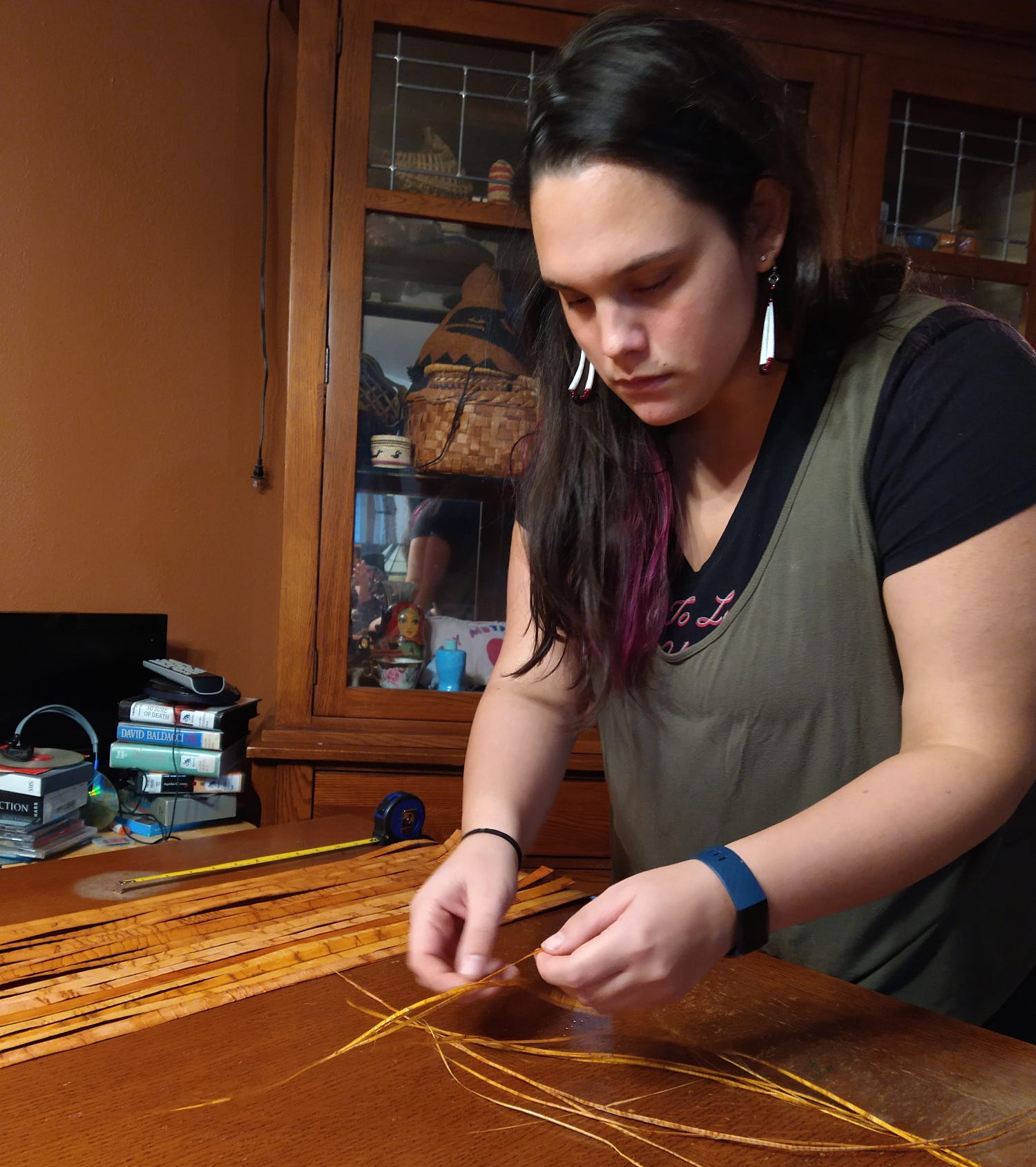 Kylee focused on weaving a traditional mat