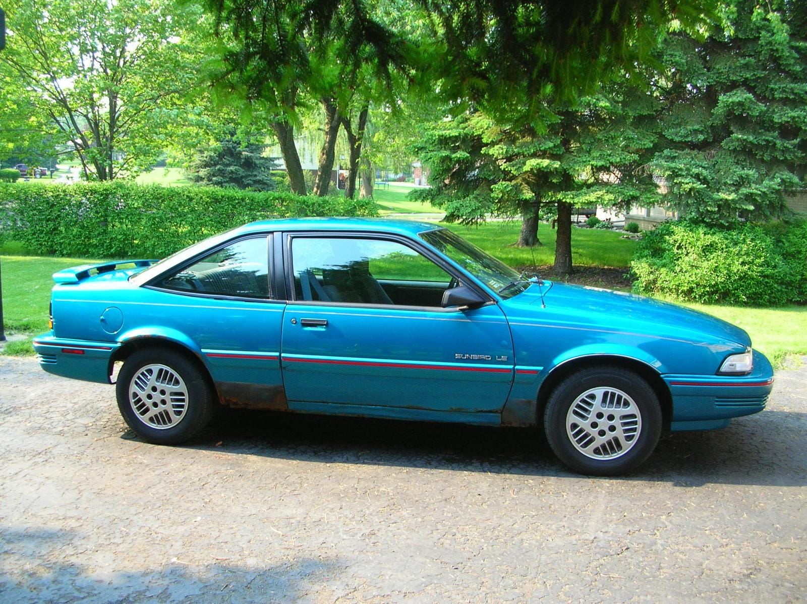 The Water Close To Shore Looks Like A Teal Green 1992 Pontiac Sunbird By Stephen M Tomic Medium