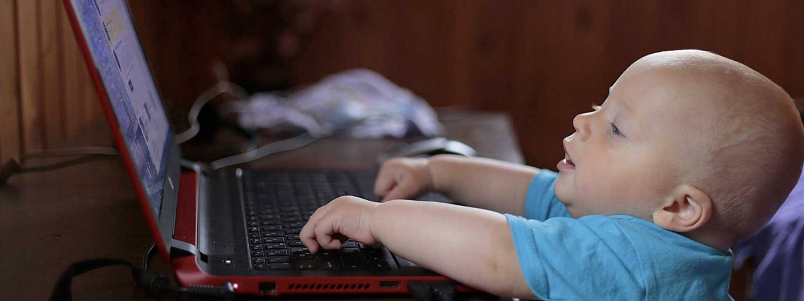 A baby using a laptop