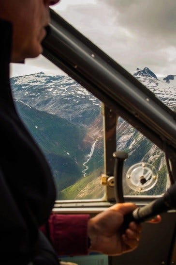 Cockpit photo of the Alaskan mountains.