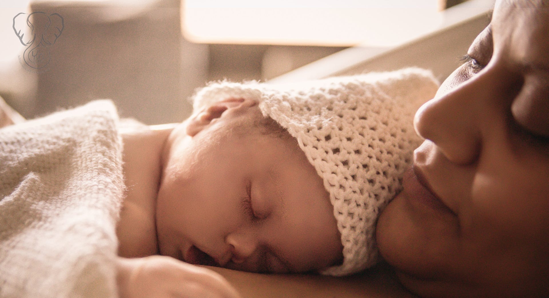 Miranda & Adrian in the hospital after birth. The lighting is golden, and although he is dead, Adrian looks like he is asleep