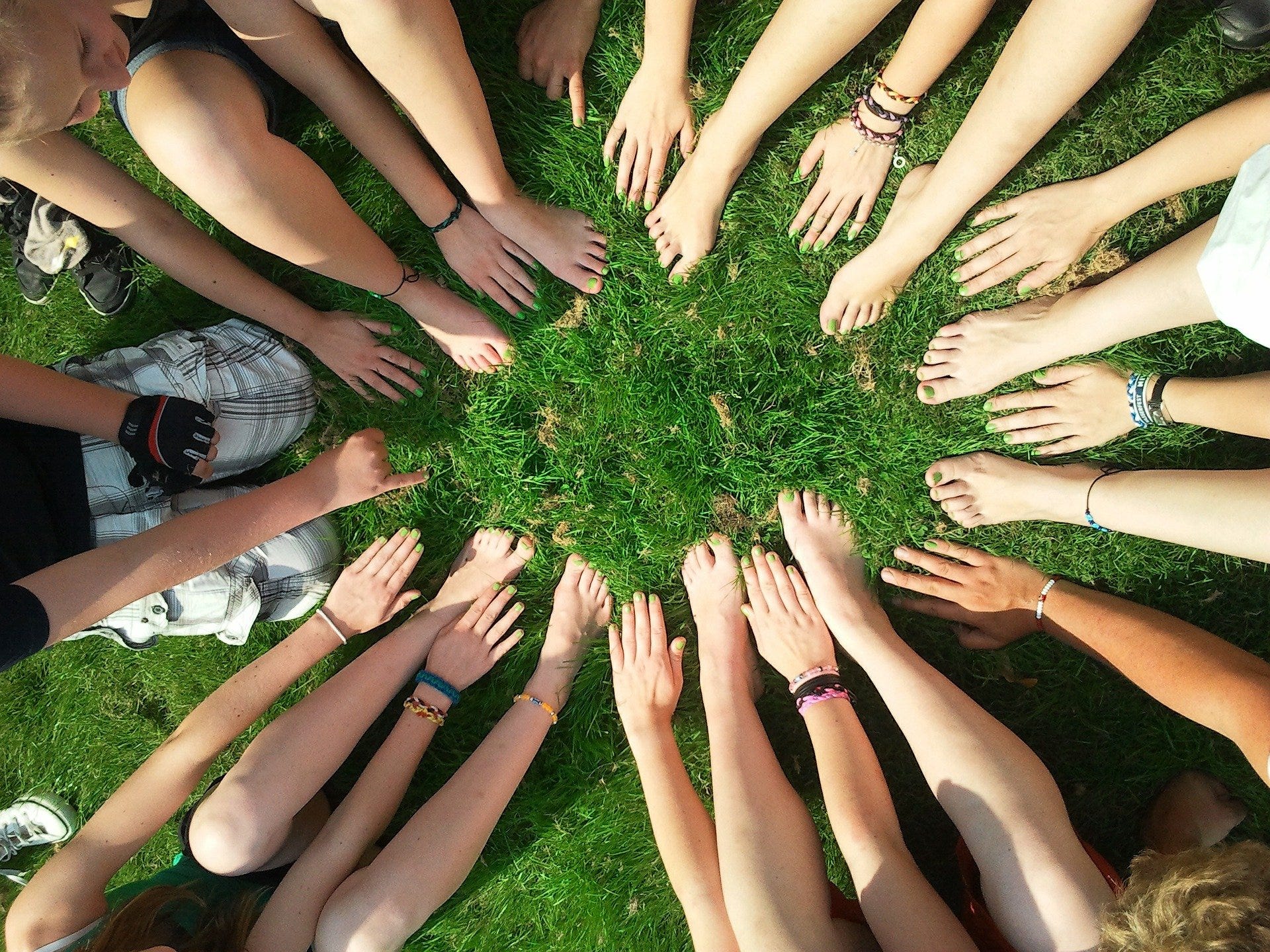 A circle made by many arms and legs