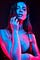 Woman in bikini under club lighting