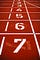Photo of race track starting line, showing numbered positions from 1 to 7.