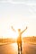 Person, running on a road, celebrating, arms lifted high