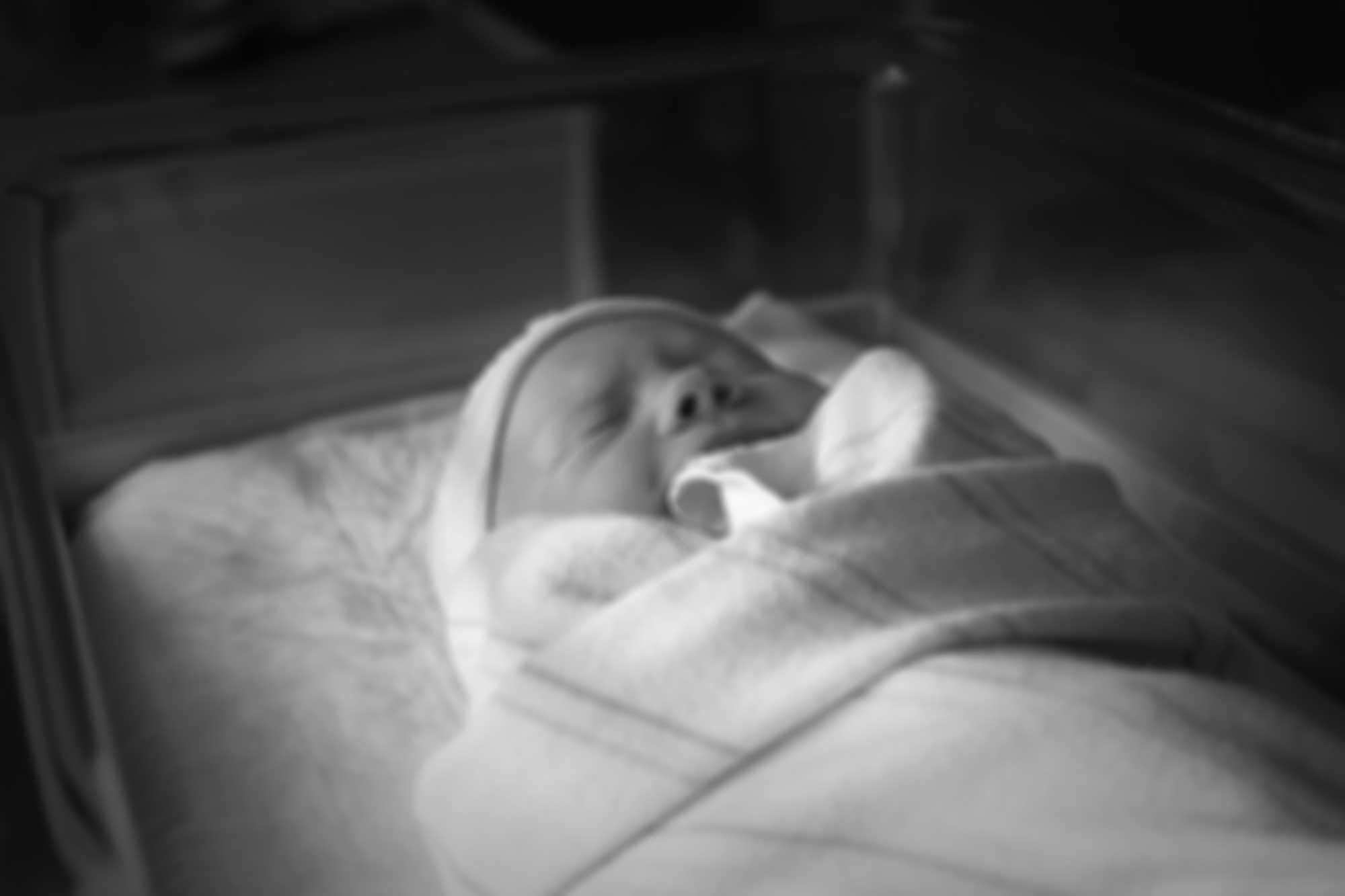baby in hospital bassinet
