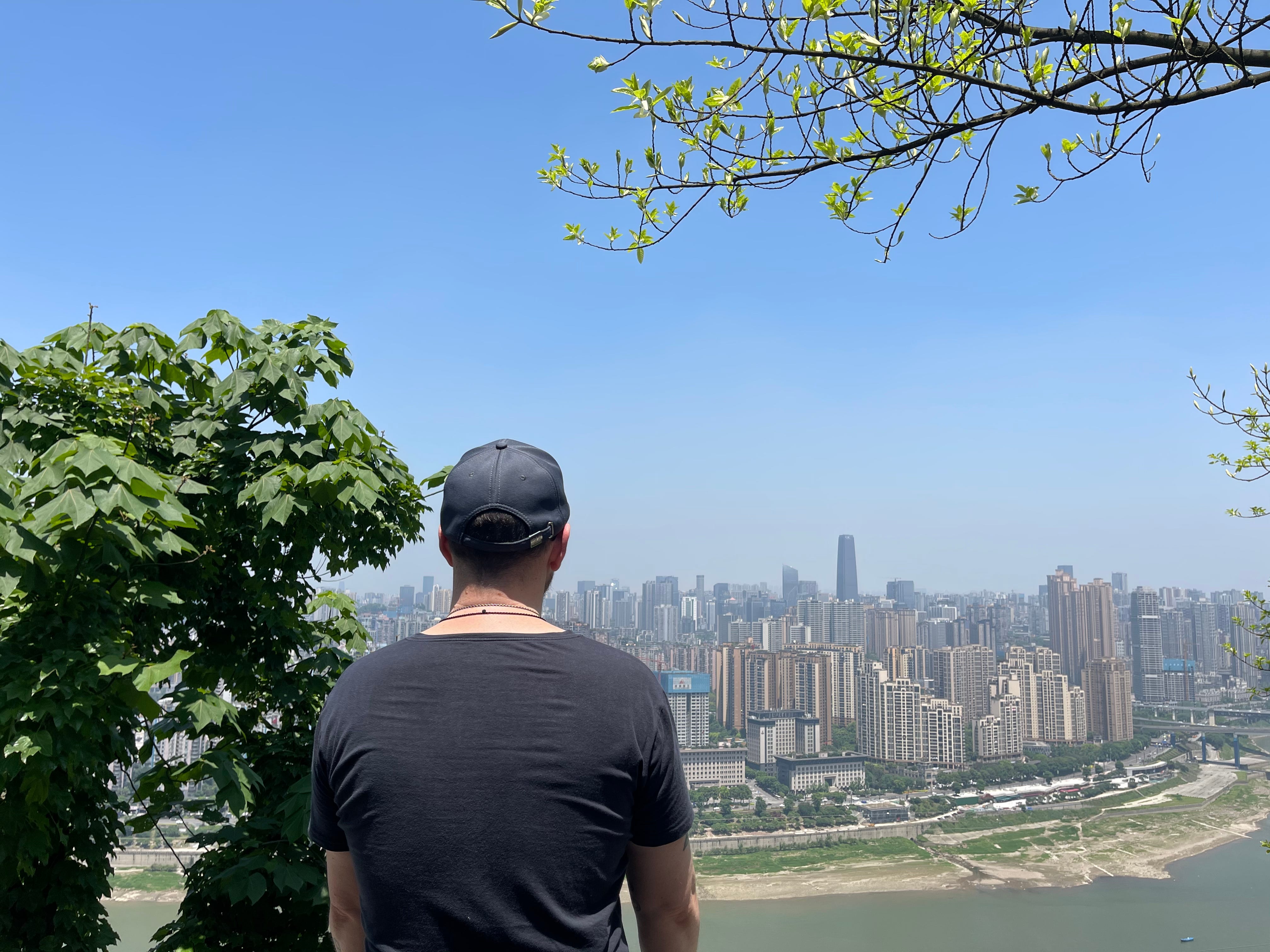 Enjoying the beautiful scenery of downtown Chongqing on the top of Nanshan.