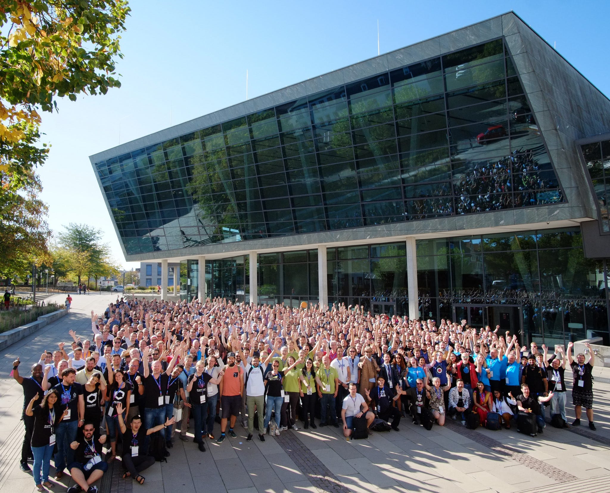 The group photo of Drupal Europe. In the front the LimoenGroen team members stand out because of their bright green clothing.