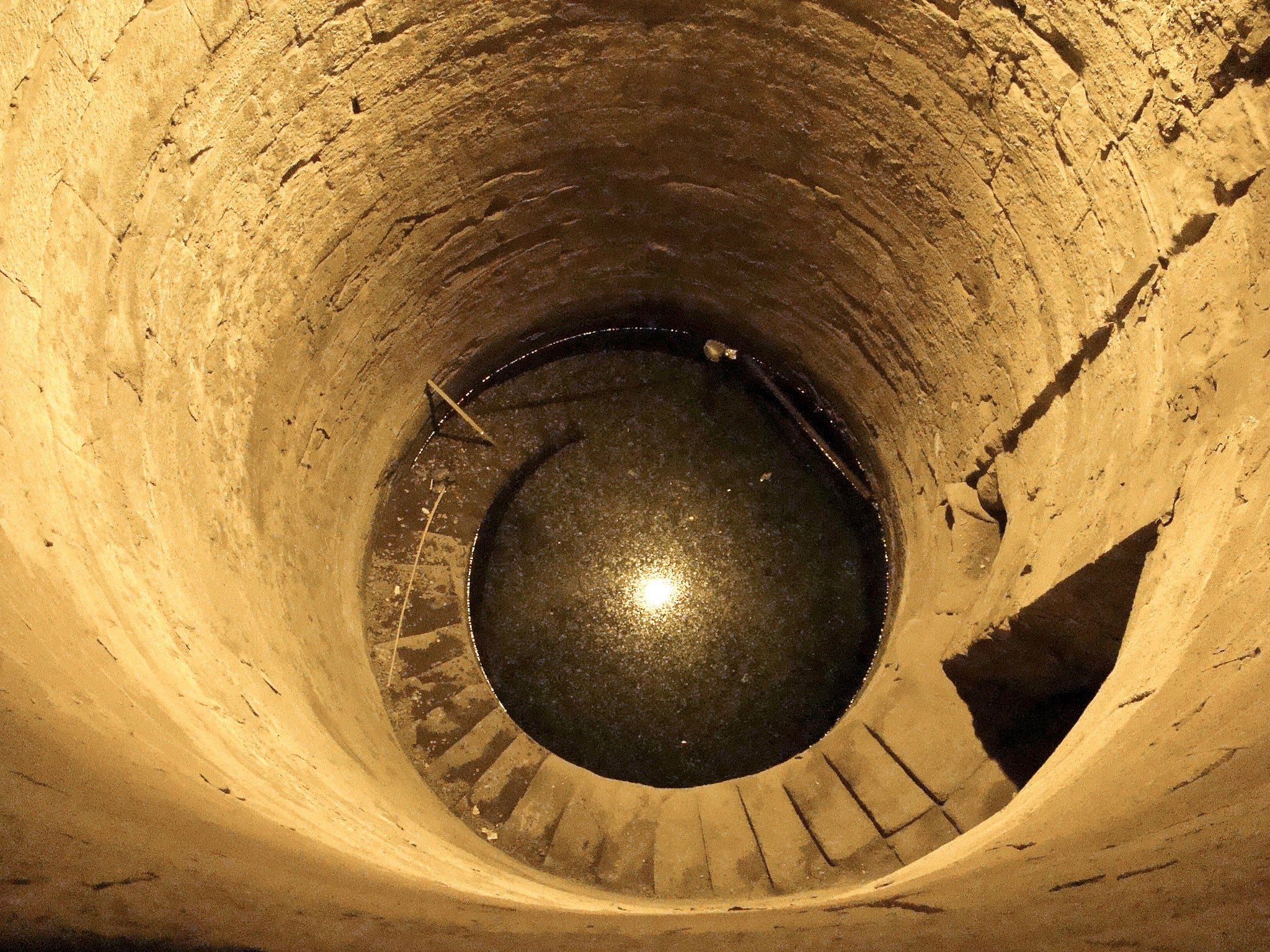 Looking Down A Well In Egypt To Measure The Size Of The Earth