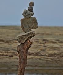 Stack of small stones on beach.