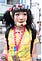 A woman wearing Harajuku style and a face mask with cartoon on her chin.